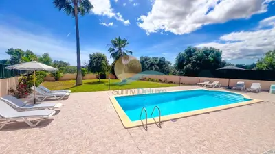 a swimming pool with chaise lounge chairs and a swimming poolvisor at Villa Pedro by Sunny Deluxe in Albufeira