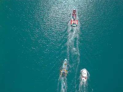 three boats in the water in the ocean at Apartment Montego Bay by Algarve Vacation in Albufeira