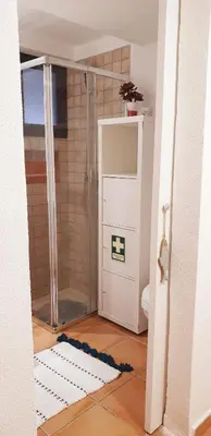 a bathroom with a shower and a toilet at Estúdio na Falésia in Albufeira
