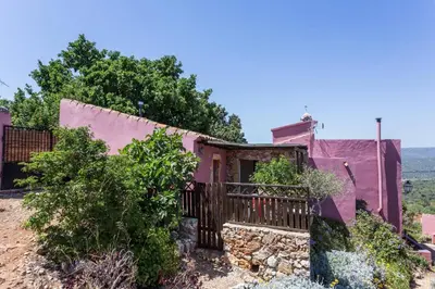 a house on the side of a hill at Casa Bi Rosario - Quinta Amoreira in Faro