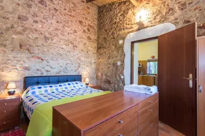 a bedroom with a bed and a dresser and a mirror at Casa Bi Rosario - Quinta Amoreira in Faro
