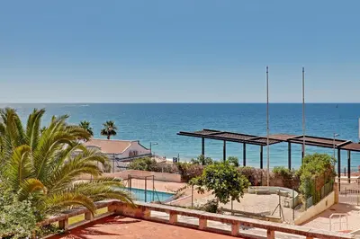 a view of a beach with the ocean in the background at Ocean Chic by the Beach in Albufeira