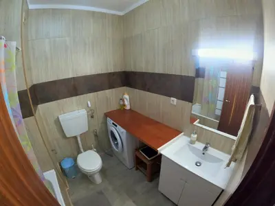a small bathroom with a sink and a toilet at Algarve, modern T1 apartment with balcony, Quarteira in Quarteira