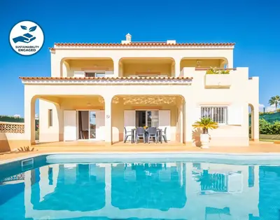 a villa with a swimming pool in front of it at Villa Canguu by Algarve Vacation in Albufeira