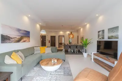a living room with a couch and a table at Albufeira Old Town Center - VERASOL 2 in Albufeira