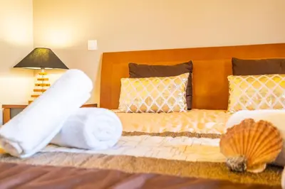 a bedroom with a bed with two stuffed animals on it at Villa Hawaii by Algarve Vacation in Albufeira