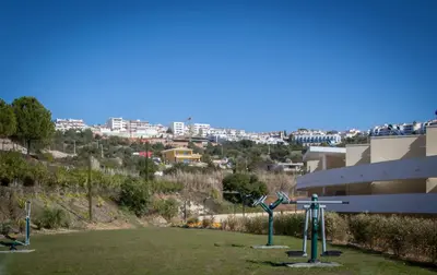 a park with statues in front of a building at Apartment Aria - Great area for children in Albufeira