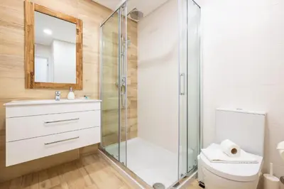a bathroom with a shower and a toilet at Studio Pimenta - Short walk to the beach in Albufeira