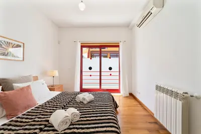 a bedroom with a bed with towels on it at Villa Marina in Albufeira
