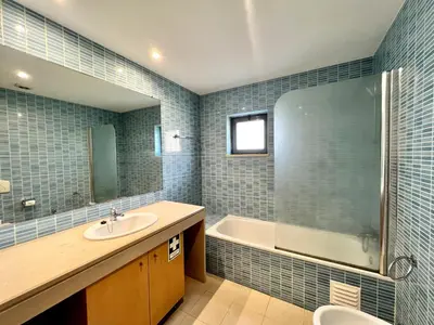 a bathroom with a sink and a tub and a shower at Albufeira Modern 3 With Pool by Homing in Albufeira