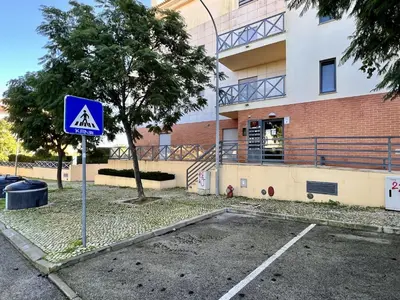 a blue sign in a parking lot in front of a building at Albufeira Modern 3 With Pool by Homing in Albufeira