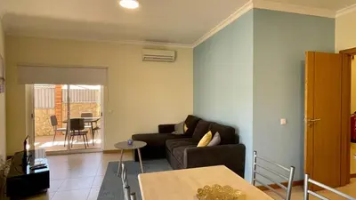 a living room with a couch and a table at Oura Oasis A by Check-in Portugal in Albufeira