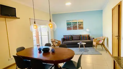 a living room with a table and a couch at Oura Oasis C by Check-in Portugal in Albufeira