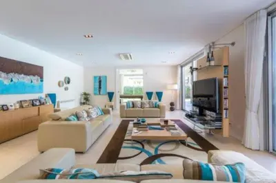 a living room with two couches and a tv at Villa Atlantic Pearl - Luxury villa located in in Quinta do Lago