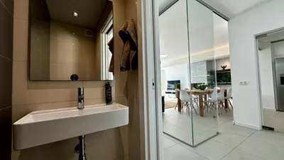 a bathroom with a sink and a mirror and a table at Moon by Check-in Portugal in Albufeira