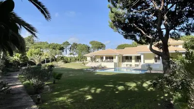 a house with a large yard with a swimming pool at Azaleas by Check-in Portugal in Vilamoura