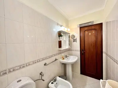 a bathroom with a toilet and a sink and a toilet istg at Vilamoura Garden View 1 With Pool by Homing in Vilamoura