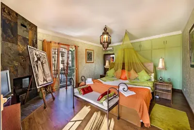a bedroom with a bed with a tent on it at Villa Mauri Luxe - Beautiful beachfront villa in Albufeira