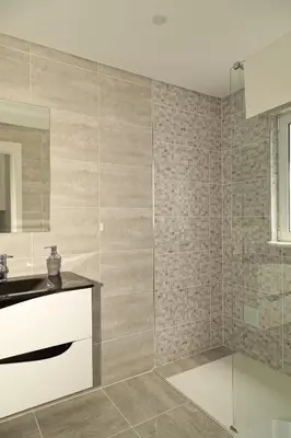 a bathroom with a shower with a sink and a mirror at O Pinhal do Avô - BY BEDZY in Almancil
