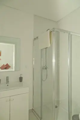 a bathroom with a shower and a sink at O Pinhal do Avô - BY BEDZY in Almancil