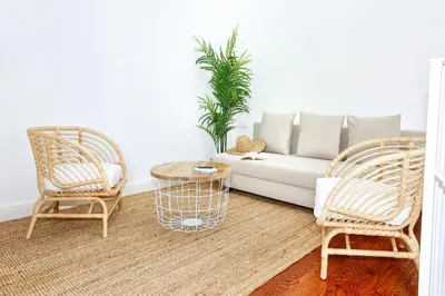 a living room with a couch and two chairs at Tropical Flavour Apartment in Faro