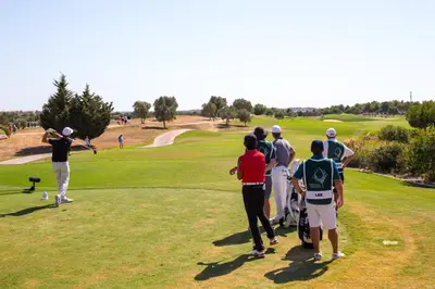 a group of people playing golf on a golf course at Victoria Secret in Vilamoura
