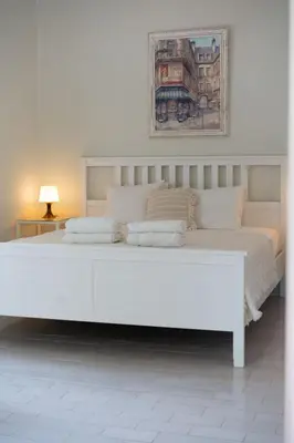 a large white bed in a white room at Beautiful private Villa with pool, Boliqueime, Loulé in Boliqueime