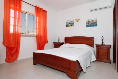 a bedroom with a bed and a window at Villa Da Duarte - walkable to beach shops bars in Albufeira
