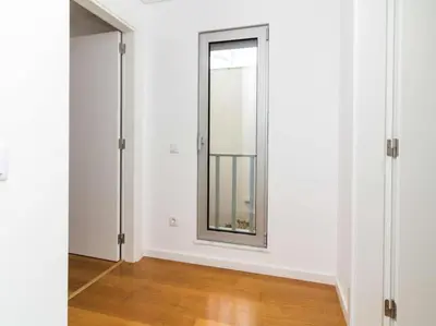 an empty room with a window and white walls at Harmony 4B House by Stay ici Algarve Holiday Rental in Albufeira