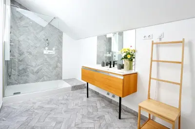 a bathroom with a tub and a sink and a shower at Zen & Tan Apartment in Faro