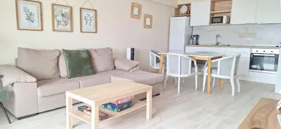 a kitchen with white cabinets and a white refrigerator at endless summer-with pool in Albufeira