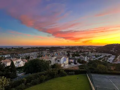 a view of a city at sunset at AlbufeiraOrada II by Be Cherish in Albufeira