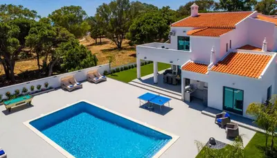 an aerial view of a house with a swimming pool at Villa Sequeira in Albufeira