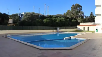 a large swimming pool on a patio at Visconde By Albufeira Rental in Albufeira