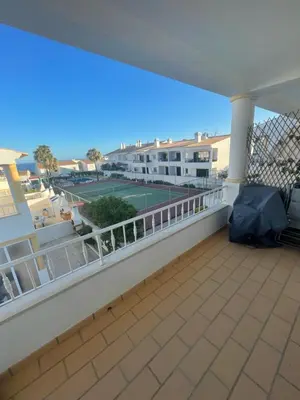a balcony with a tennis court on it at casa Vela in Albufeira