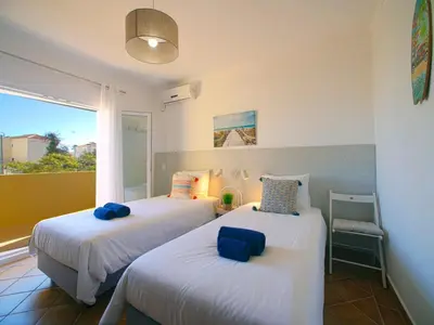 two beds in a room with a window at Villa Mariana by Interhome in Galé