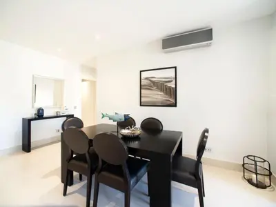a living room with a couch and a tv at Apartment Pine Hills Ametista by Interhome in Vilamoura