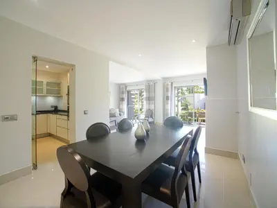 a bedroom with two beds and a large mirror at Apartment Pine Hills Pérola by Interhome in Vilamoura