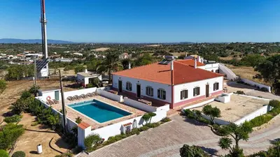 an aerial view of a house with a swimming pool at Quinta Coelho in Guia