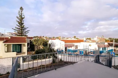 a view from the balcony of a house with a fence at Oura Villa V2 Flores in Albufeira