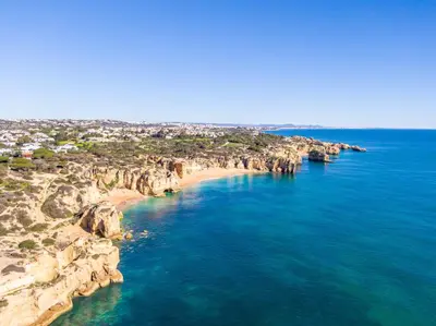 an aerial view of a beach with rocks and the ocean at Villa Molucas by Algarve Vacation in Albufeira