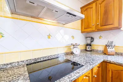 a kitchen with a sink and a counter top at Villa Estrelícia - Pool - Free wi-fi - New in Booking in Loulé