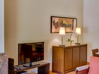 a living room with a large flat screen tv at AL - Apartamento Vila Sol F5 AO in Vilamoura