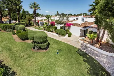 an aerial view of a yard with trees and bushes at Victory Village Beach Villa - Quinta do Lago in Quinta do Lago