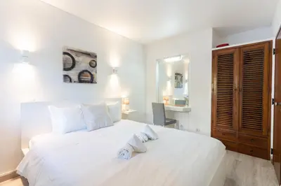 a kitchen with stainless steel appliances and a microwave at #109 Zélio House by Home Holidays in Albufeira