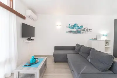 a bedroom with a bed and a window with a home hollywood sign at #109 Zélio House by Home Holidays in Albufeira