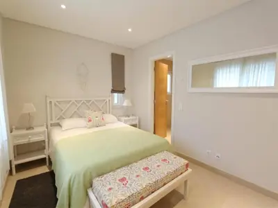 a white bedroom with a bed and a window at Lovely Vilamoura Villa 4 Bedrooms Villa Pinhal Short Drive To Marina in Quarteira