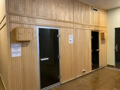 a row of wooden doors in a building at Sunset Haven in Albufeira - Short walk to Oldtown in Albufeira