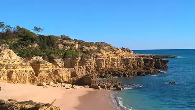 a view of a beach with the ocean at Casa Francisco : Family Villa with private pool. Near to beach in Albufeira