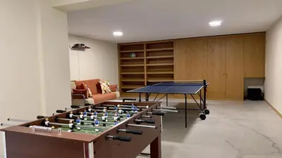 a room with a ping pong table and a table tennis at Marina by Check-in Portugal in Albufeira